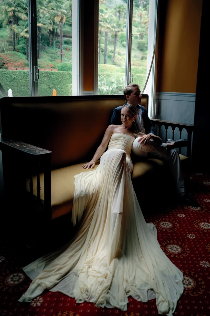 Couple sharing a romantic moment on a signature velvet sofa in the luxury interiore of Grand Hotel Tremezzo