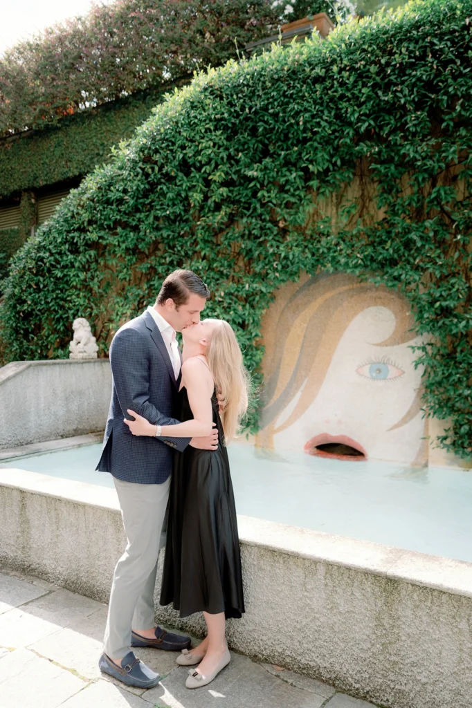 Candid moment of a couple in the gardens of Grand Hotel Tremezzo on Lake Como
